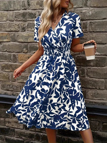 Front view of the Peacock Blue Printed Smocked Dress, showcasing the intricate print and smocked detailing.