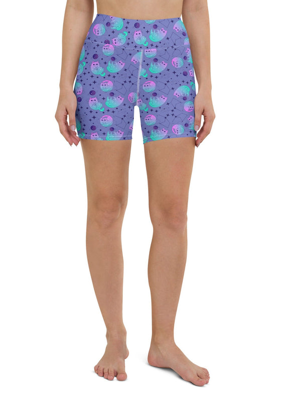 Full front view showcasing slate blue high-waisted yoga shorts with cosmic cat design