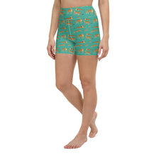  Front view of high-waisted yoga shorts in Niagara green with a bold leopard print design.
