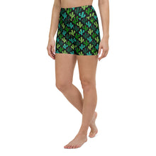  Front view of black high-waisted yoga shorts with a bold lizard print.
