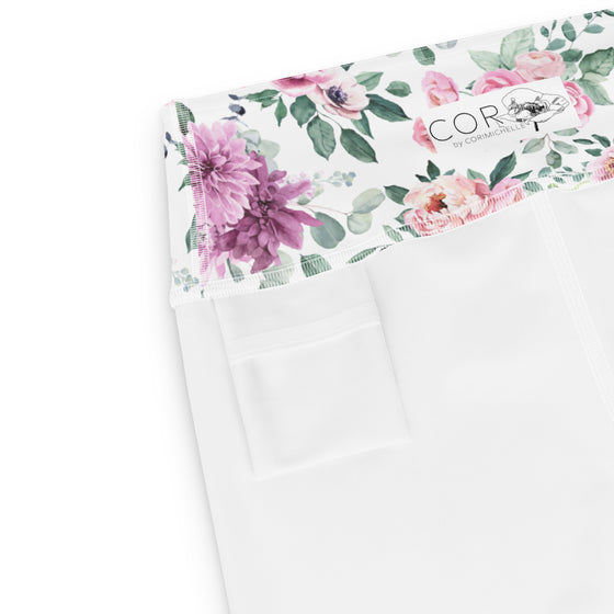 Close-up of small inside pocket in white floral yoga shorts, perfect for small essentials.
