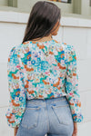 Back perspective revealing the clean finish, subtle back closure, and lightly gathered fabric, giving this piece a smooth, polished shape.

