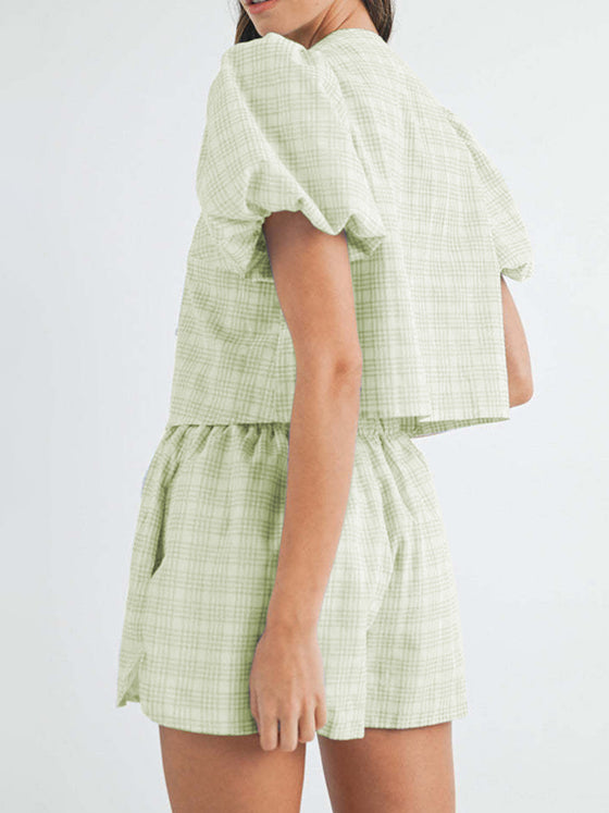 Back view showcasing the flattering fit of the light green set, with the soft puff sleeves and simple yet stylish shorts, perfect for casual outings.

