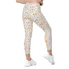 Back view of spring floral print leggings with bees and butterflies. High waist compression leggings for women with pockets for fitness and daily wear.
