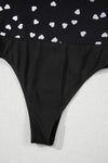 Close view of the bottom closure showing the secure snap fasteners, reinforced hem, and soft stretch mesh for a comfortable and practical fit.

