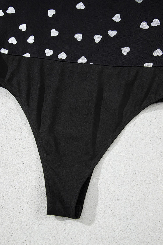 Close view of the bottom closure showing the secure snap fasteners, reinforced hem, and soft stretch mesh for a comfortable and practical fit.

