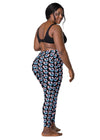 Back view of plus-size woman in Black Butterfly Dreams High-Waisted Leggings with Pockets. Stylish, supportive leggings with butterfly print and high-waisted fit, great for any activewear collection.