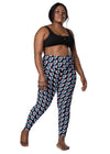 Plus-size woman wearing Black Butterfly Dreams High-Waisted Leggings with Pockets. Flattering high-waisted fit with a stylish butterfly print, perfect for every body type.