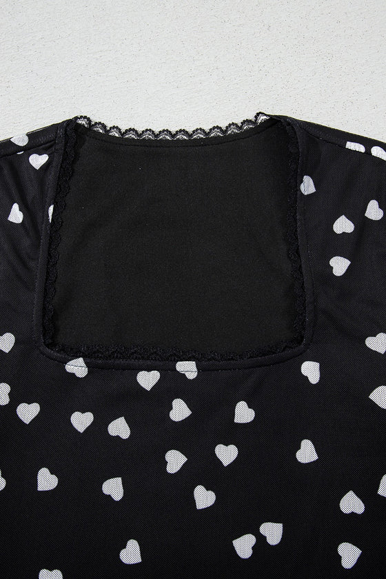 Closeup of the neckline from the front, showing the smooth trim finish, elegant curve of the neck seam, and how the mesh subtly softens into skin.

