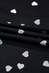 Up-close fabric image showing the lightweight sheer mesh, charming heart design, and air-light construction for breathable, stylish layering.

