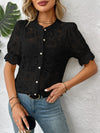 Front pose of black half sleeve lace button-down shirt styled with jeans, adding a bold touch to feminine fashion.