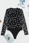Back flat view of the bodysuit, detailing the fully mesh construction, heart print coverage, and snap-button closure area subtly hidden at the base.

