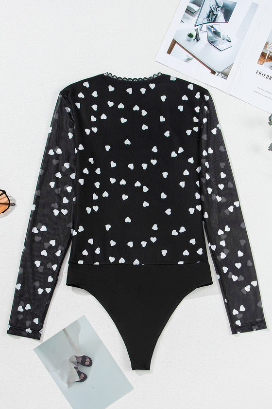 Back flat view of the bodysuit, detailing the fully mesh construction, heart print coverage, and snap-button closure area subtly hidden at the base.

