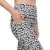 Closeup of Black & White Rosette High-Waisted Leggings showing side pockets. Designed for comfort, with compression fit, perfect for workouts and casual wear.