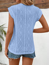 Back view showcasing the subtle scallop hem and easy fit in breathable eyelet cotton material.


