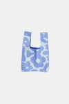 Front view of the blue flower-knitted handbag, beautifully knitted with intricate floral designs in shades of blue. Adds a touch of color to your accessories.