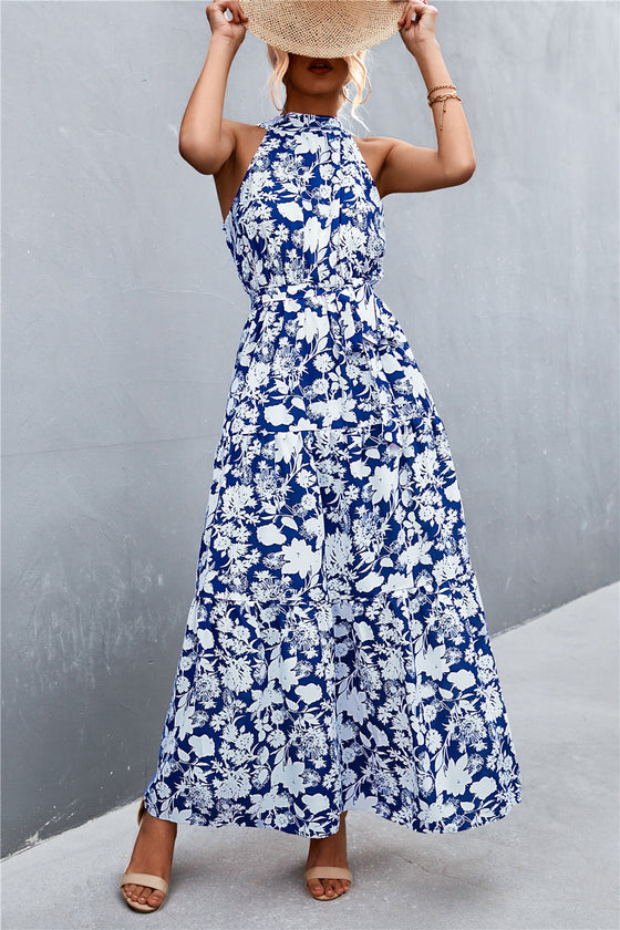 Blue sleeveless maxi dress with printed details and adjustable waist belt—relaxed fit for holidays, weekend wear, and resort styling.