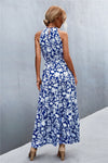 Back of blue printed maxi dress with tie waist design—light and elegant outfit for beach vacations or casual outings.
