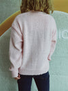 Back view of the Bow Trim Round Neck Long Sleeve Sweater showcasing its bow embellishments and cozy design.