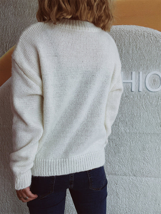 Back view of the Bow Trim Round Neck Long Sleeve Sweater showcasing its bow embellishments and cozy design.