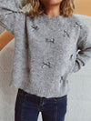 Front view of the Bow Trim Round Neck Long Sleeve Sweater showcasing its bow embellishments and cozy design.