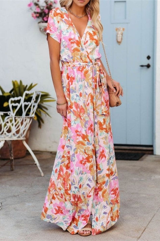  Elegant front view of the burnt coral maxi dress with soft floral prints, a breezy silhouette, and a casual yet stylish waist tie feature.

