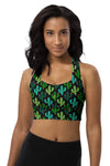 Woman wearing the Cactus Bloom Black High Impact Racerback Sports Bra. Featuring a bold cactus print and a playful lizard design, offering high support, breathable mesh lining, and a secure racerback fit for workouts.