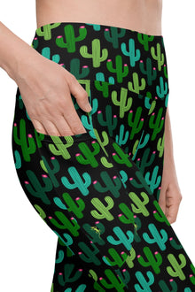  Close-up of Cactus Bloom Black High-Waisted Leggings with Pockets, highlighting the secure side pocket design for gym, yoga, and everyday wear.