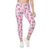 Model wearing compression leggings for women in black with pink cactus print. Back angled view showing pocket and contour design.