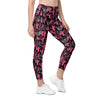 Front view of woman wearing high waist leggings with pockets in cactus cowgirl print. Stylish gym leggings with compression support and tapered fit.