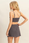Back view of the Charcoal Bra Top and Mini Skirt Set, showcasing the clean lines and figure-flattering cut.