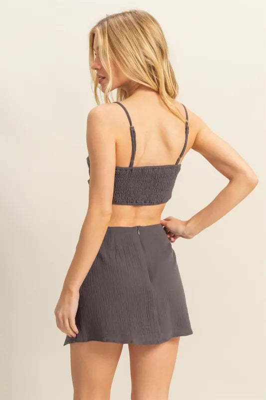 Back view of the Charcoal Bra Top and Mini Skirt Set, showcasing the clean lines and figure-flattering cut.