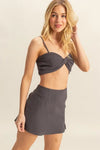 Front-facing shot of the Charcoal Bra Top and Mini Skirt Set, highlighting the modern and minimalistic look.