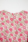 Close-up of the back neckline of the floral tank, showing the neat fabric seam details and smooth finishing that enhance comfort and style for the wearer.

