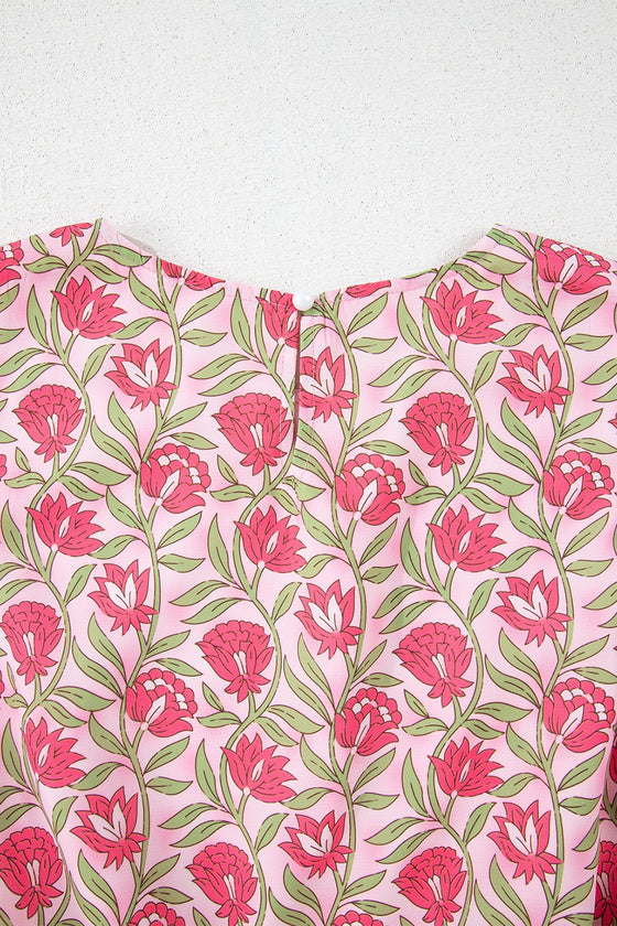 Close-up of the back neckline of the floral tank, showing the neat fabric seam details and smooth finishing that enhance comfort and style for the wearer.

