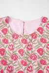 Close-up of the tank top’s front neckline, highlighting the delicate fabric details, soft texture, and vibrant floral embroidery that adds a charming touch to the piece.

