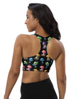 Back view of woman wearing Colorful Mushrooms Black Gym Sports Bra. High support, racerback design, and double-layered front provide a secure, comfortable fit for running, jumping, and weightlifting.
