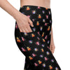 Closeup of Cori Michelle black leggings showing beetle bug print and side pocket. High waisted compression leggings with pockets for women.
