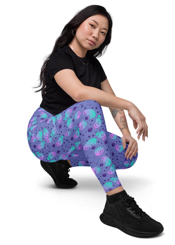 Side view of woman sitting, showcasing the sleek and comfortable design of Cosmic Cat Slate Blue high-waisted leggings with pockets.
