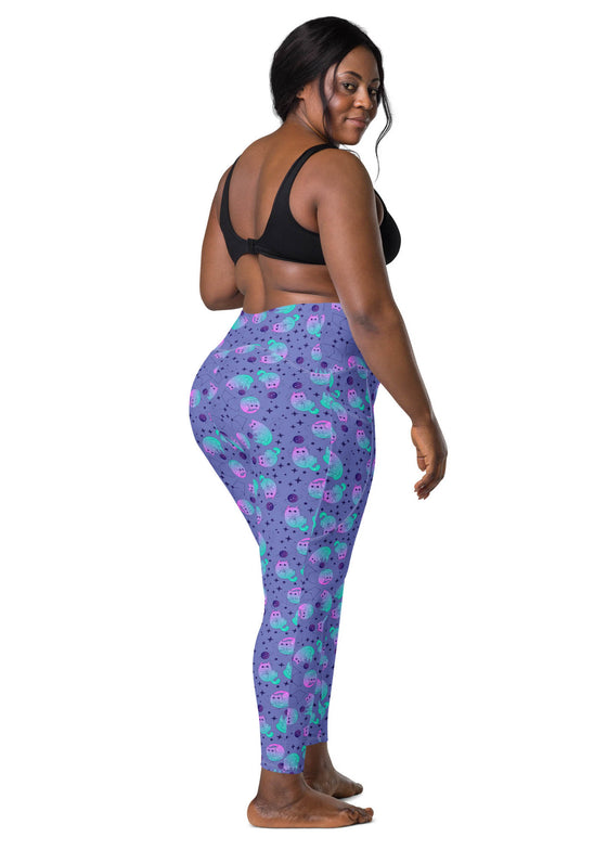 Back view of plus-size woman in Cosmic Cat Slate Blue high-waisted leggings with pockets. Designed to offer a flattering fit for all body types.
