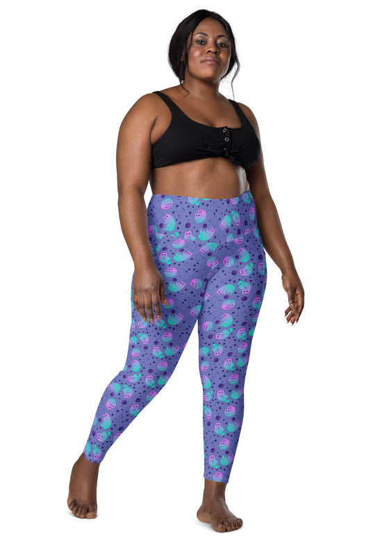 Plus-size woman wearing Cosmic Cat Slate Blue high-waisted leggings with pockets. Designed for comfort and a perfect fit, offering flexibility and style.