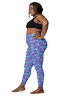 Side view of plus-size woman in Cosmic Cat Slate Blue high-waisted leggings with pockets. Designed to offer a flattering fit for all body types.
