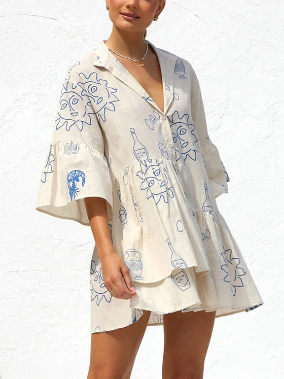 A close-up front view of the Cream Button Detail Printed Mini Dress showcasing the intricate floral print and button details.

