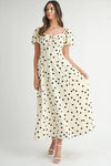 Cream puff sleeve midi dress with polka dots shown in full front view, highlighting its flowy silhouette and romantic charm.