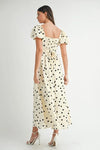 Full back view of cream midi dress with puff sleeves and soft dot print, offering a graceful and comfortable finish.