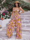 Front view of the Cutout Printed Spaghetti Strap Jumpsuit with wide legs and a bold cutout design.