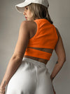 Back view of the Cutout Round Neck Tank in white, featuring a bold cutout detail and a comfortable, stylish design.