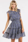 A stylish front angle of the Dark Navy Whisper Floral Ruffle Mini Dress, showcasing its elegant silhouette, romantic ruffles, and beautiful floral print.