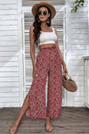 Front view of ditsy floral slit paperbag waist wide-leg pants.