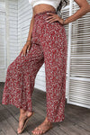 Side view of ditsy floral slit paperbag waist pants showing wide-leg fit and slit detail.